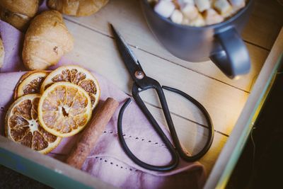 High angle view of fruits in plate on table