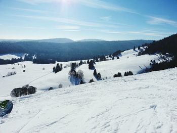 Scenic view of snow covered mountains against sky