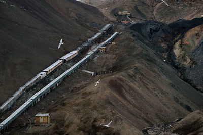 High angle view of tire tracks on road