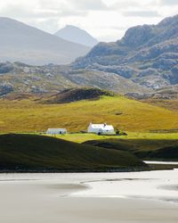 Scenic view of landscape and mountains against sky