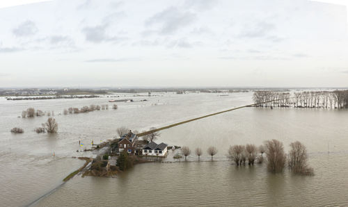 Netherlands, aerial view of river waal flooding surrounding land after prolonged rainfall