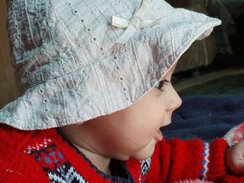 Midsection of woman wearing hat