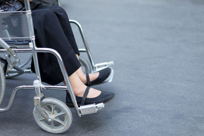 Low section of woman on wheelchair