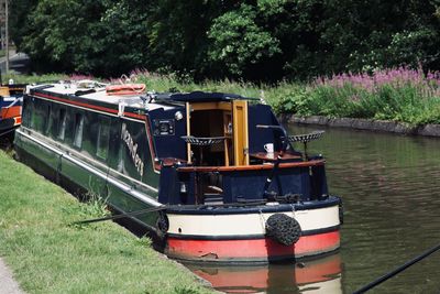 Boat moored on riverbank