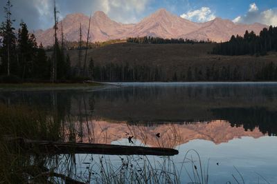 Scenic view of lake and mountains against sky