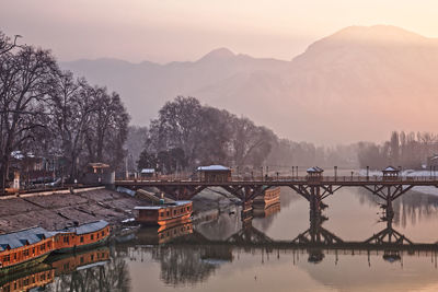 Bridge over river against sky during sunrise, srinagar kashmir 