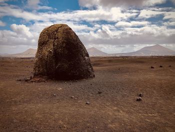 Rock formations on landscape against sky