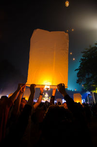 People enjoying music concert at night