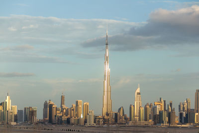 Modern buildings in city against sky