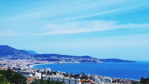 City by sea against sky