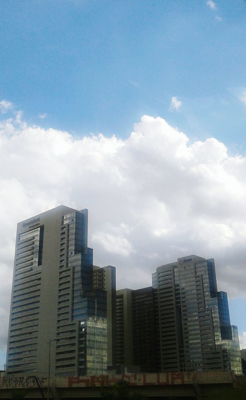 skyscraper, architecture, building exterior, city, sky, urban skyline, cloud - sky, cityscape, no people, built structure, outdoors, day, modern