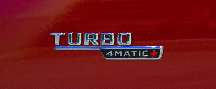 Close-up of text on red wall
