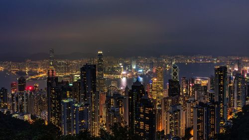 High angle view of illuminated city buildings at night