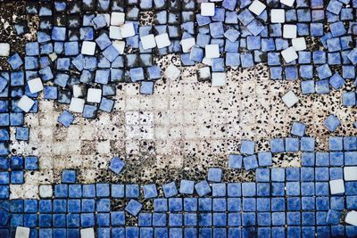 Full frame shot of tiled floor by swimming pool