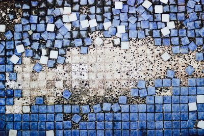 Abandoned swimming pool close up of tiles