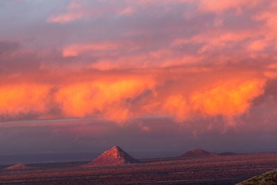 Pyramids in desert during sunset