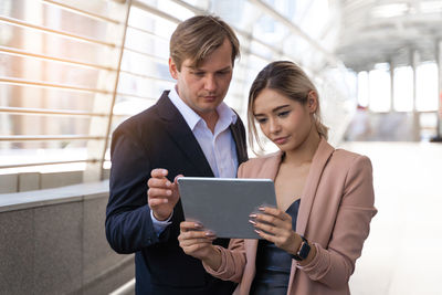 Young couple holding smart phone