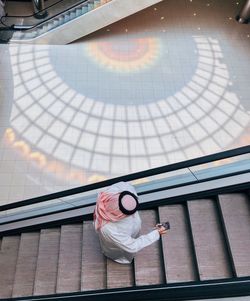 High angle view of woman with umbrella