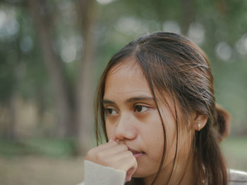 Close-up portrait of a serious young woman