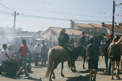People riding horse during event