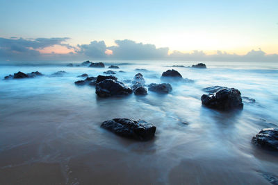 Scenic view of sea against sky during sunset