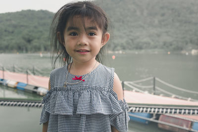 Portrait of cute girl standing outdoors