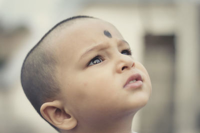 Close-up of boy looking away