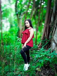 Portrait of young woman in forest