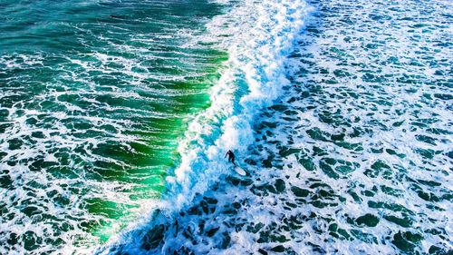 High angle view of water flowing in sea