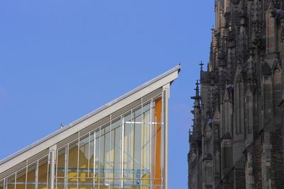 Low angle view of building against clear blue sky