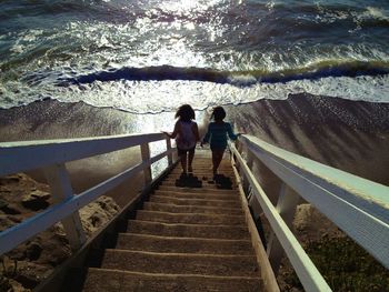 People walking on railing