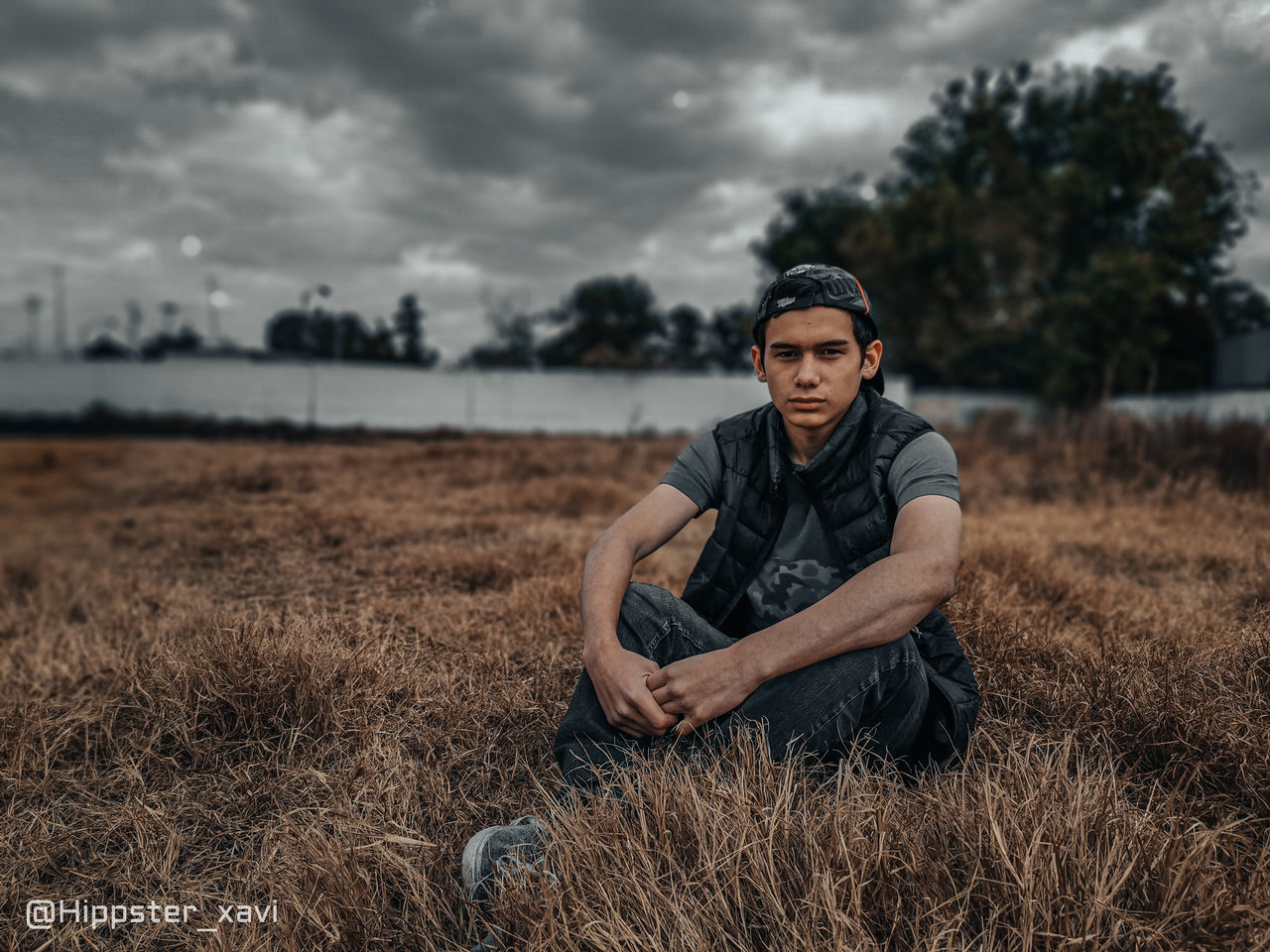 PORTRAIT OF HANDSOME YOUNG MAN ON FIELD