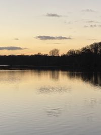 Scenic view of lake against sky during sunset