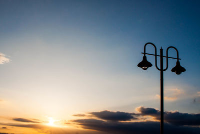 Low angle view of street light against sky