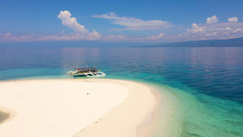 Perfect beach with blue water and white sand.  digyo island, philippines. 