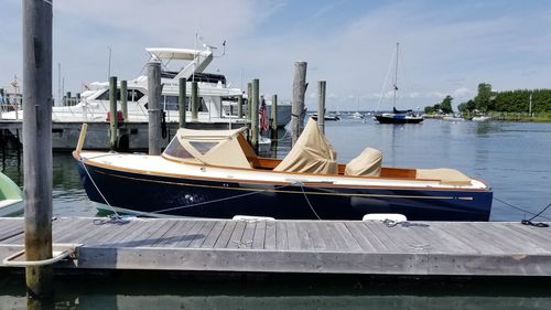 Boats moored at harbor