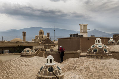 View of a building with mountain range in background