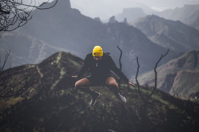 Man on mountain against sky