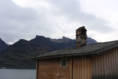 House by building against sky