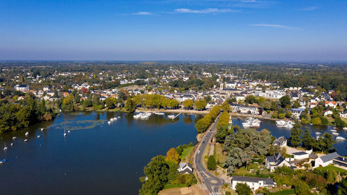 High angle view of buildings and trees against sky