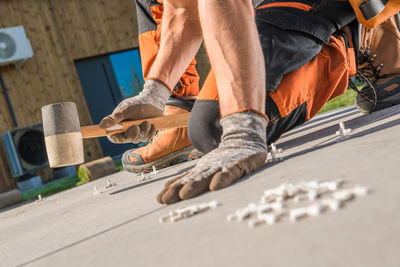 Low section of man working at workshop