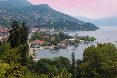 Scenic view of sea and buildings against sky