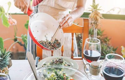 Midsection of man preparing food on table