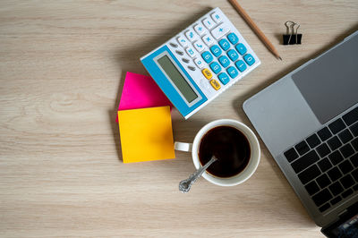 High angle view of coffee cup on table