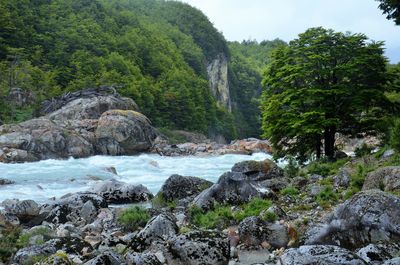 Scenic view of waterfall against sky