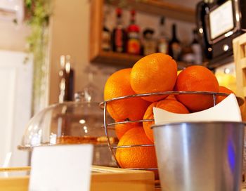 Counter bar with oranges friuts and basket