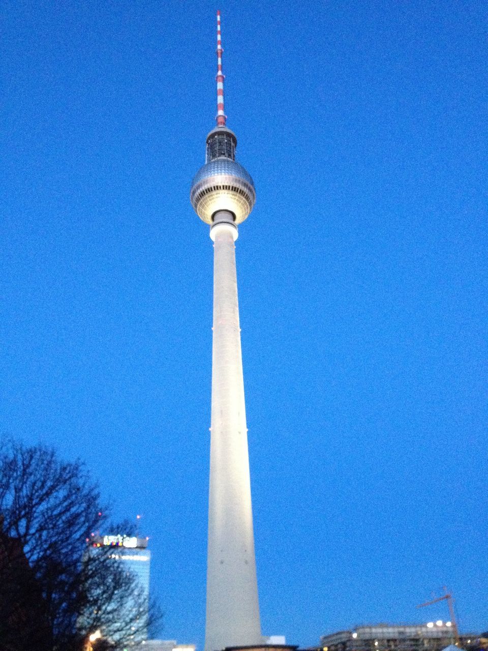 tower, communications tower, tall - high, international landmark, built structure, architecture, famous place, travel destinations, tourism, capital cities, travel, building exterior, spire, blue, television tower, low angle view, clear sky, fernsehturm, communication, culture