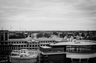 High angle view of buildings in city against sky