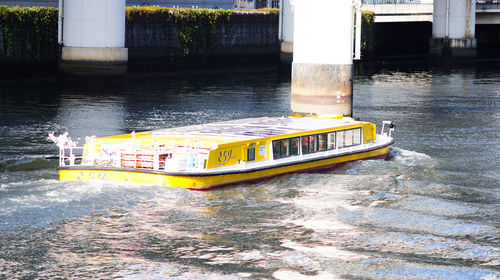 Yellow boat on road in city