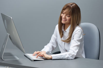 Young woman using laptop at home